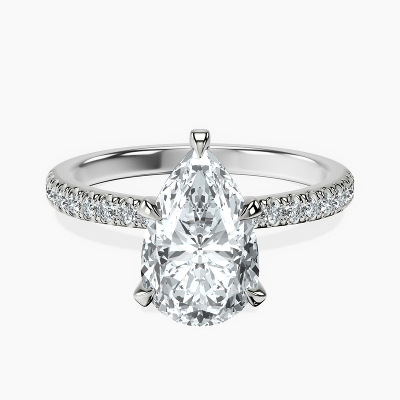 1.33 ct. pear Etienne Secret Halo Ring in 10kt white gold rtr top