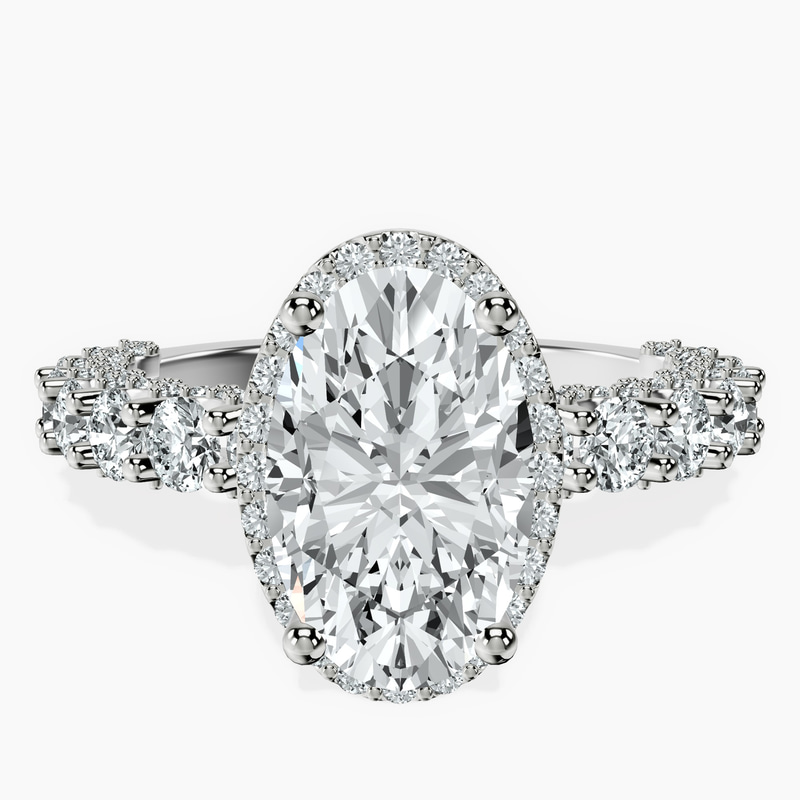 2.90 ct. oval Enchanté side stone halo ring in 18kt white gold rtr top