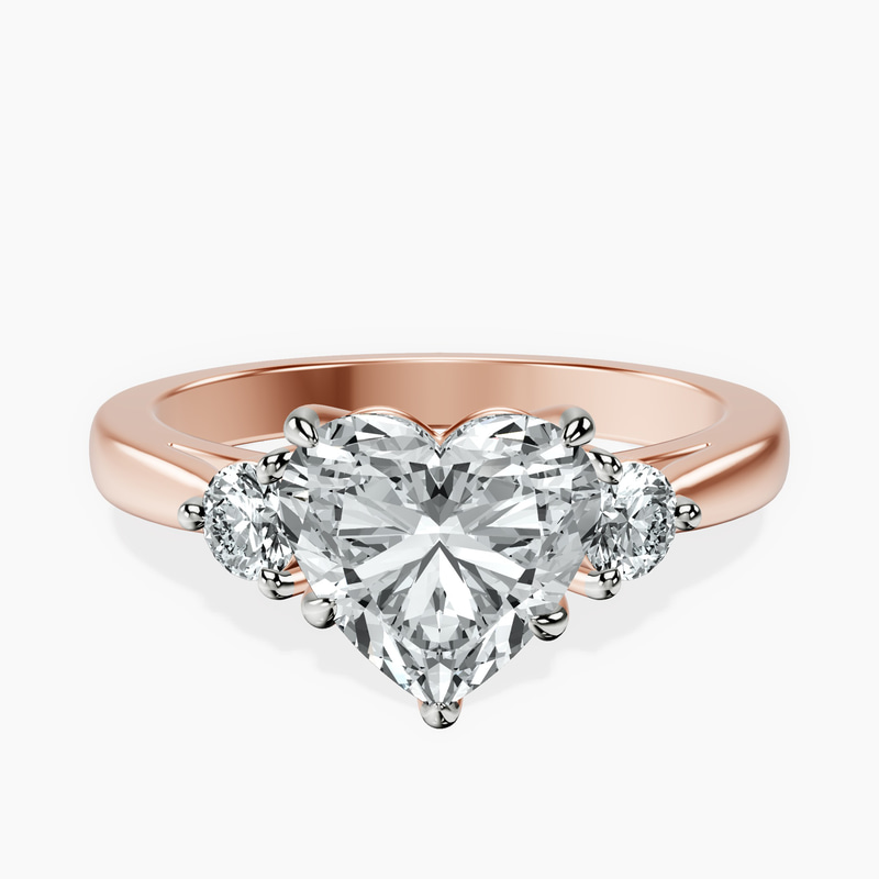 2.70 ct. heart Synthia Three Stone Ring in 18kt rose gold rtr top