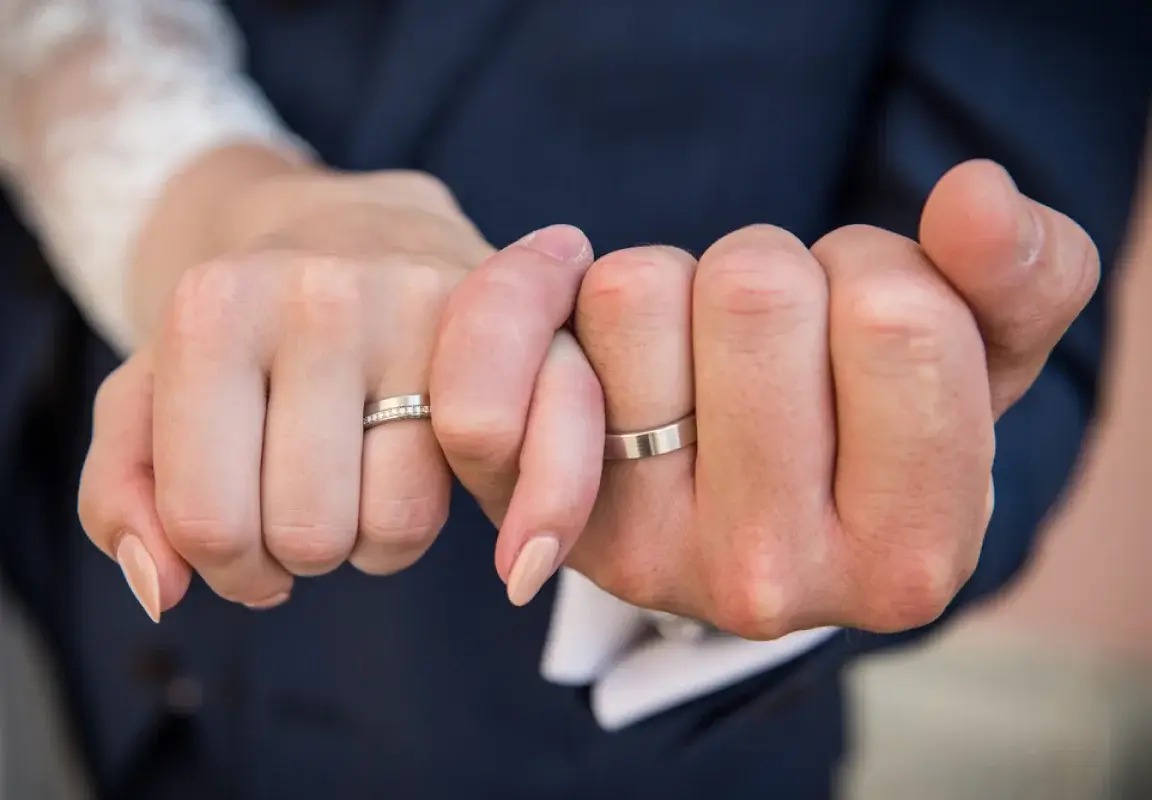 Photo of Couple posing with a ring on their engagement night
